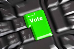 Tecla de enter con el texto "votar"