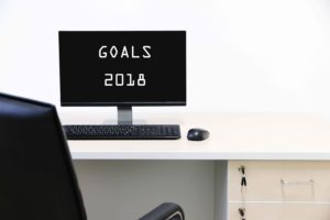 Pantalla de ordenador con el mensaje "Objetivos 2018"